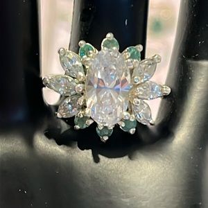 Sterling Silver Emerald and Oval Cut 7/16 CZ center stone. Pre Owned